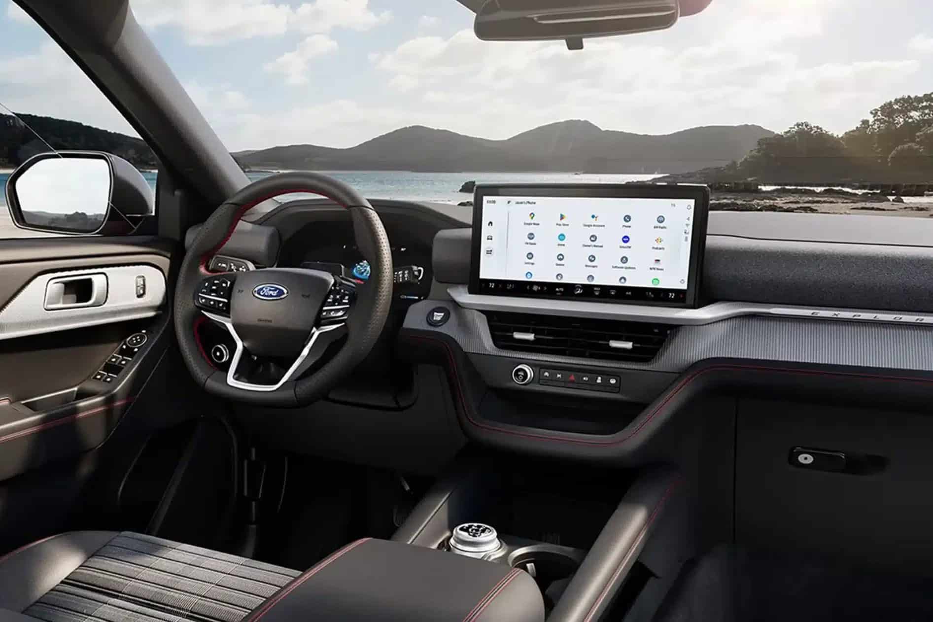 2027 Ford Explorer interior, steering wheel and dashboard with coastal view
